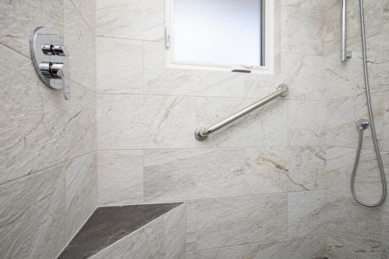 built-in seat in a newly renovated shower