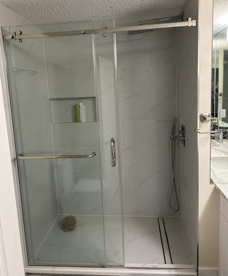 custom renovated walk-in shower with white tiles and rainfall shower head